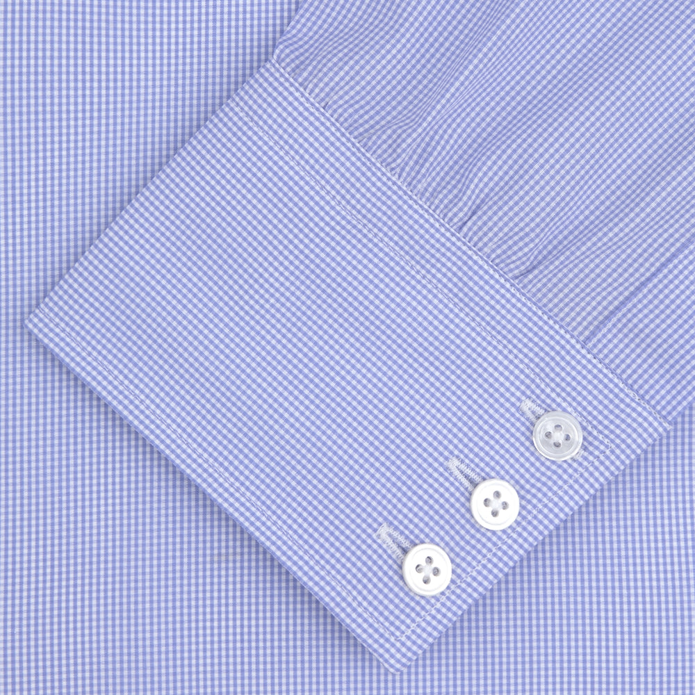 A neatly folded Turnbull & Asser Blue Fine Check Sea Island Quality Cotton Shirt features a T&A collar, 3-button cuffs, subtle micro-check pattern, and white buttons down the front.