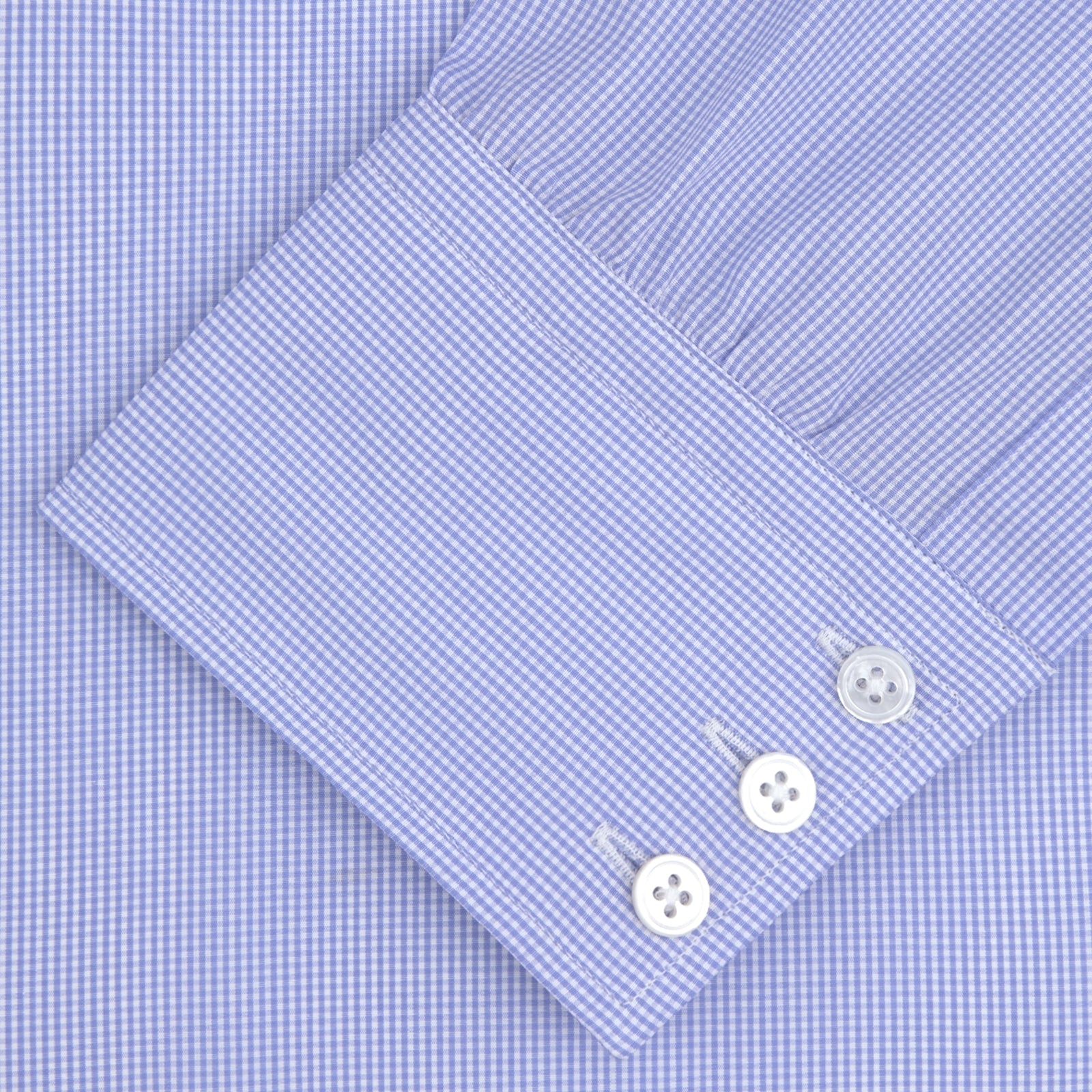 View 2 of product A neatly folded Turnbull & Asser Blue Fine Check Sea Island Quality Cotton Shirt features a T&A collar, 3-button cuffs, subtle micro-check pattern, and white buttons down the front.