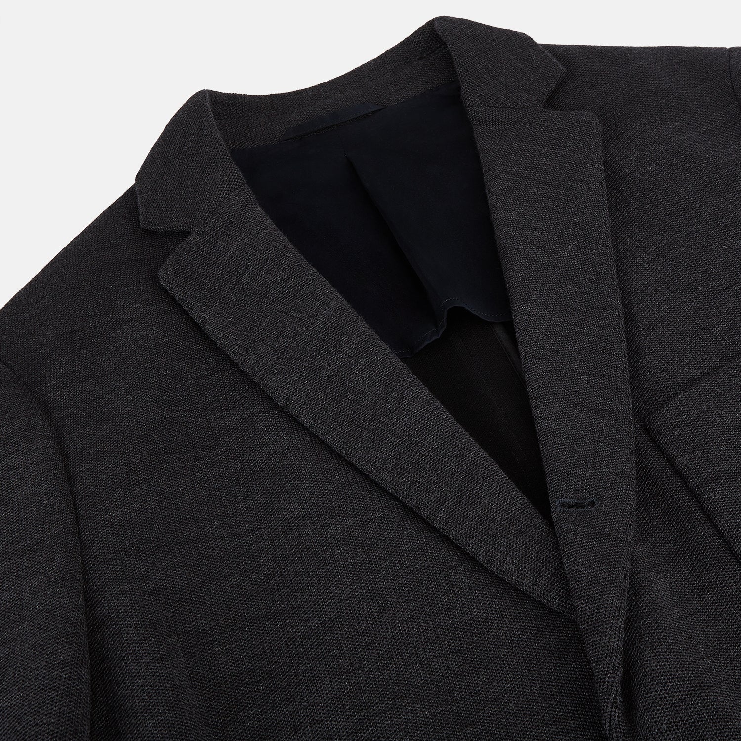 View 2 of product The Turnbull & Asser Charcoal Knitted Oxford Blazer features a notched lapel, two-button closure, and three front pockets, blending modern elegance with British heritage against a plain white background.