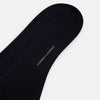 View 3 of product The Turnbull & Asser Azzurro/violet Dash Striped Long Sock, crafted from mercerised Egyptian cotton, features thin blue pinstripes on black and is shown upright against a plain white background.