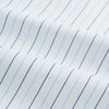 View 6 of product The Turnbull & Asser Blue Wide Pinstripe Mayfair Shirt is a long-sleeved, collared, button-down style crafted from organic cotton, featuring wide blue pinstripes on a white background.