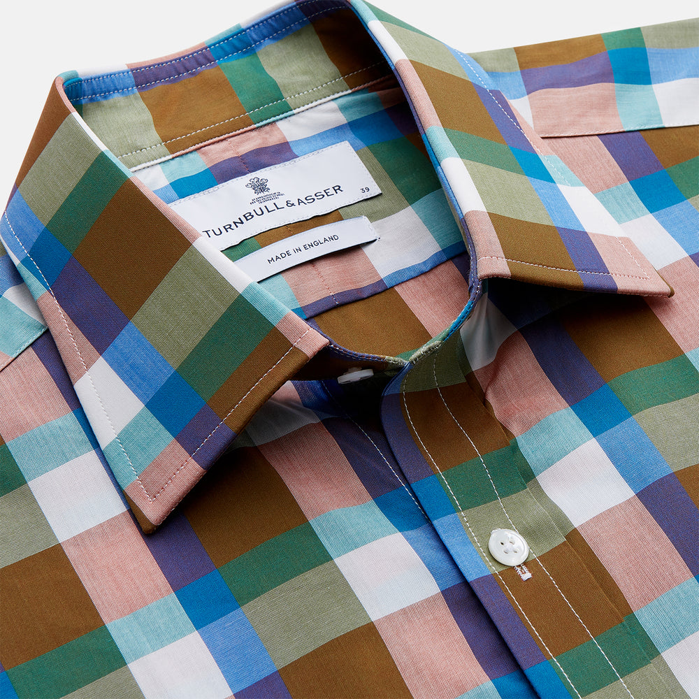 The Turnbull & Asser Green and Pink Multi-check Cotton Blend Regular Fit Mayfair Shirt features a classic T&A collar, white buttons, and an olive green, blue, white, and pink plaid pattern.