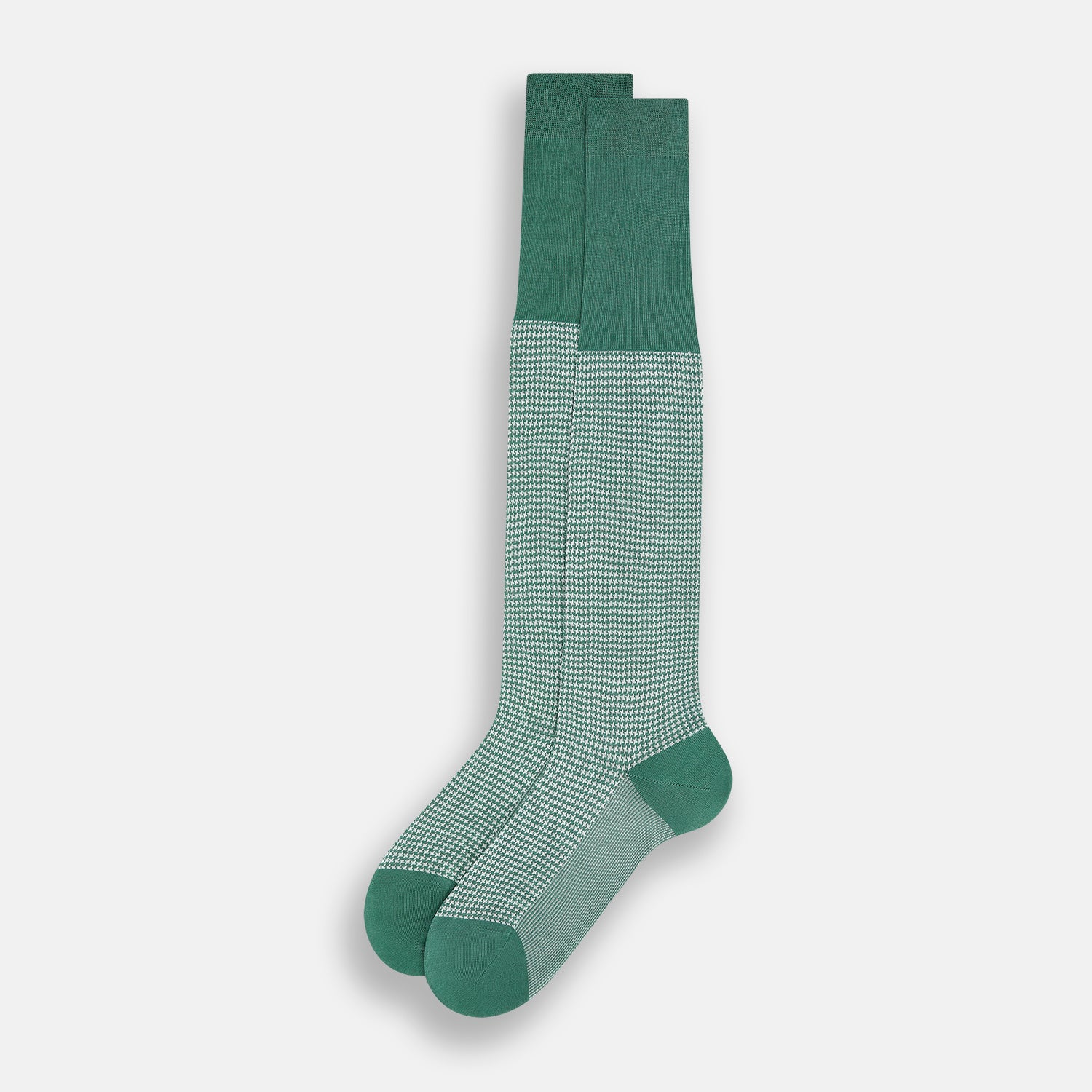 View 2 of product The Ivory/green Houndstooth Long Sock by Turnbull & Asser features a houndstooth pattern on the lower half with a solid green upper band, heel, and toe, shown against a white background.