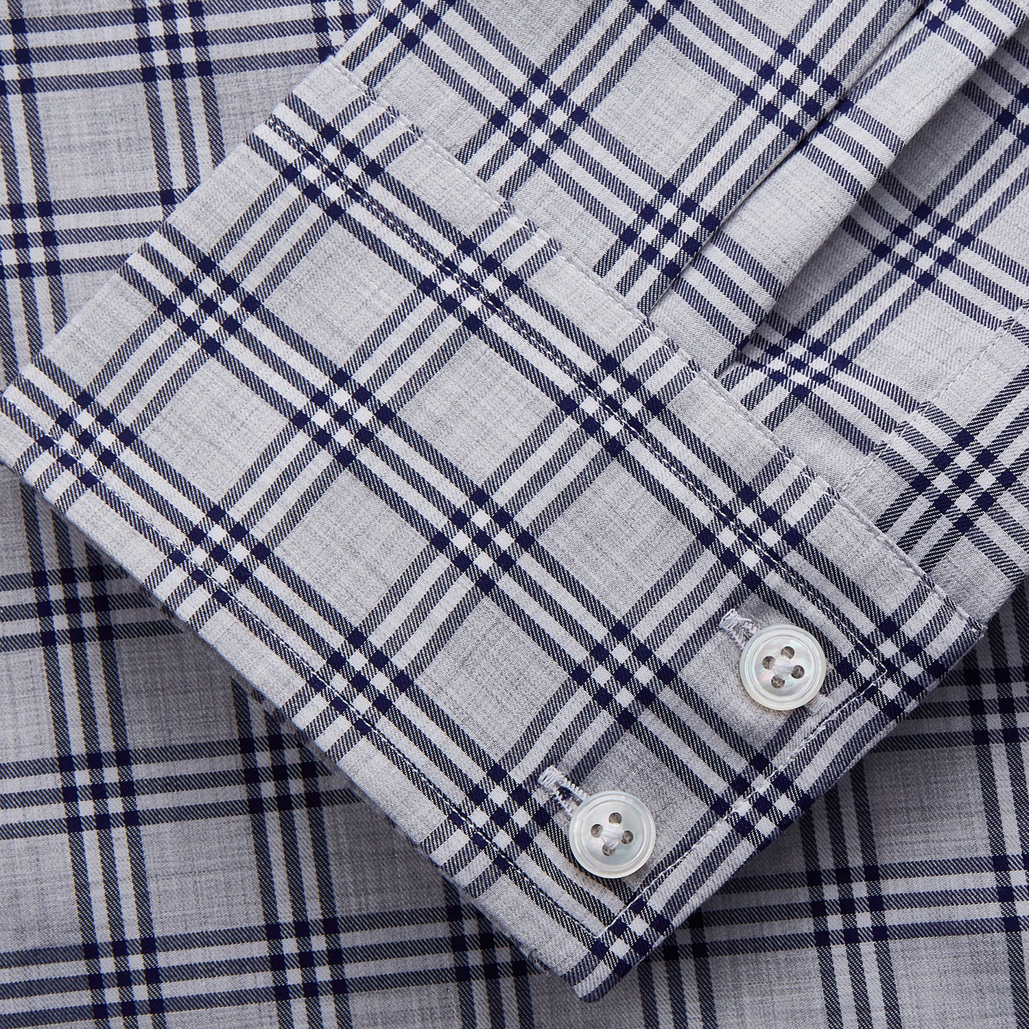 View 4 of product The Turnbull & Asser Grey Multi Check Cotton Tailored Fit Shelton Shirt is neatly laid flat on a white background.