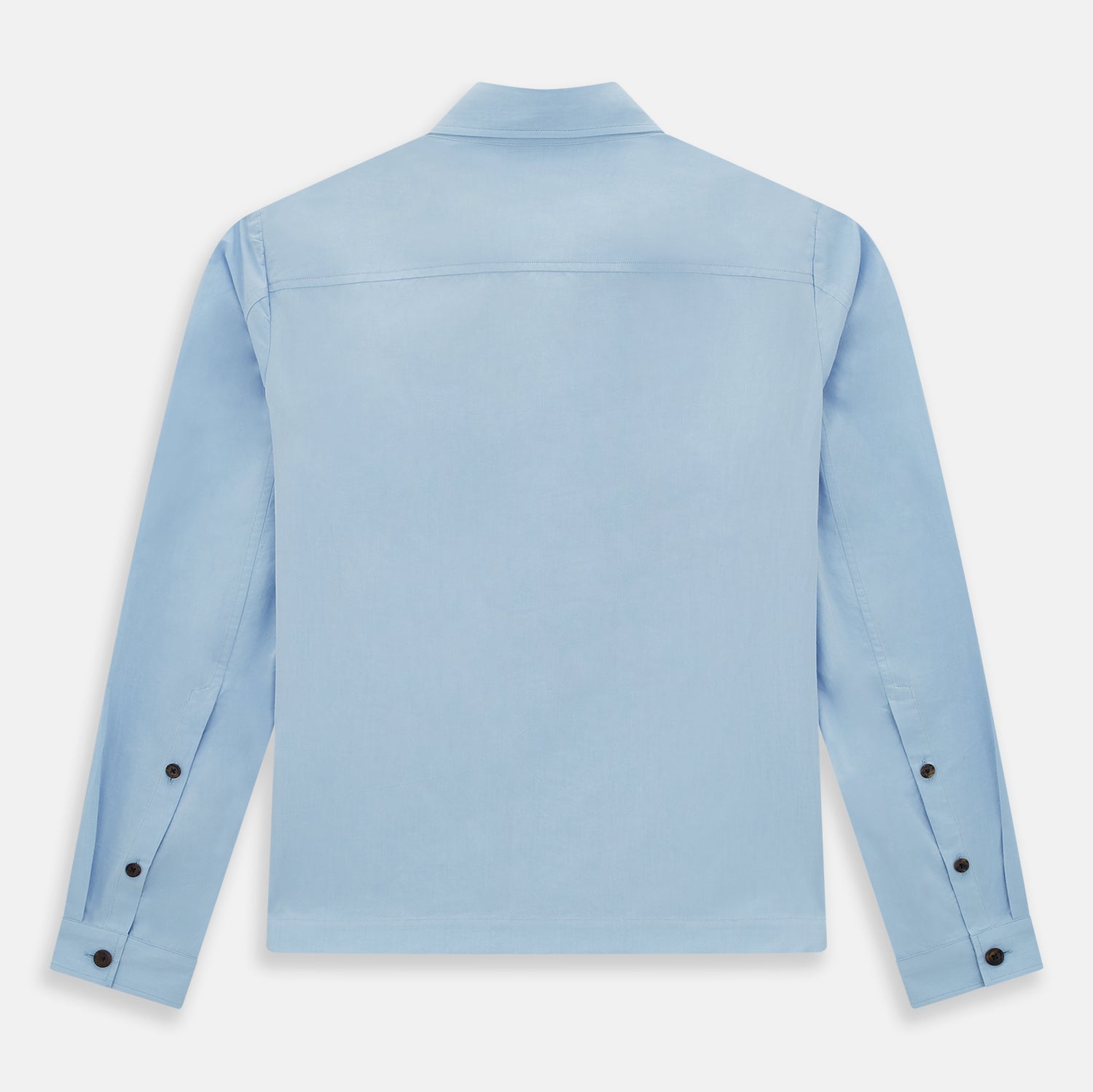 View 3 of product The Blue Hyde Overshirt by Turnbull & Asser features a light blue hue, long sleeves, a button-up front, and a single chest pocket. Crafted from sanforised cotton and shown laid flat on a white background.