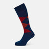 View 1 of product Turnbull & Asser’s Royal Blue Check Mid-Length Sock features a blue base with red, orange, and blue checks on the calf, shown against a plain white background.