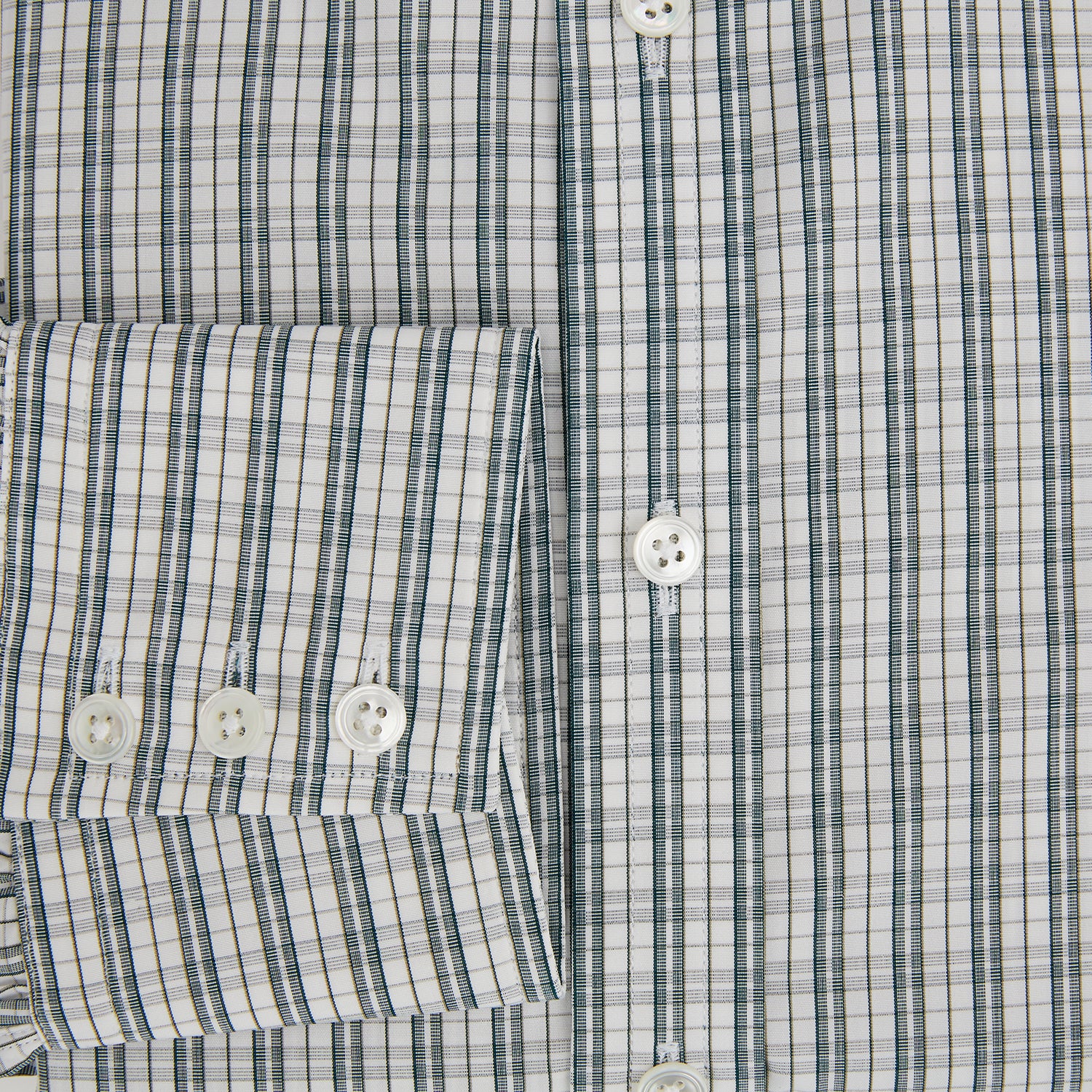 View 4 of product The Turnbull & Asser Forest Green Multi Check Mayfair Shirt is a long-sleeve button-up crafted from premium Italian cotton, featuring a blue and forest green check on white, with a pointed collar and buttoned cuffs.