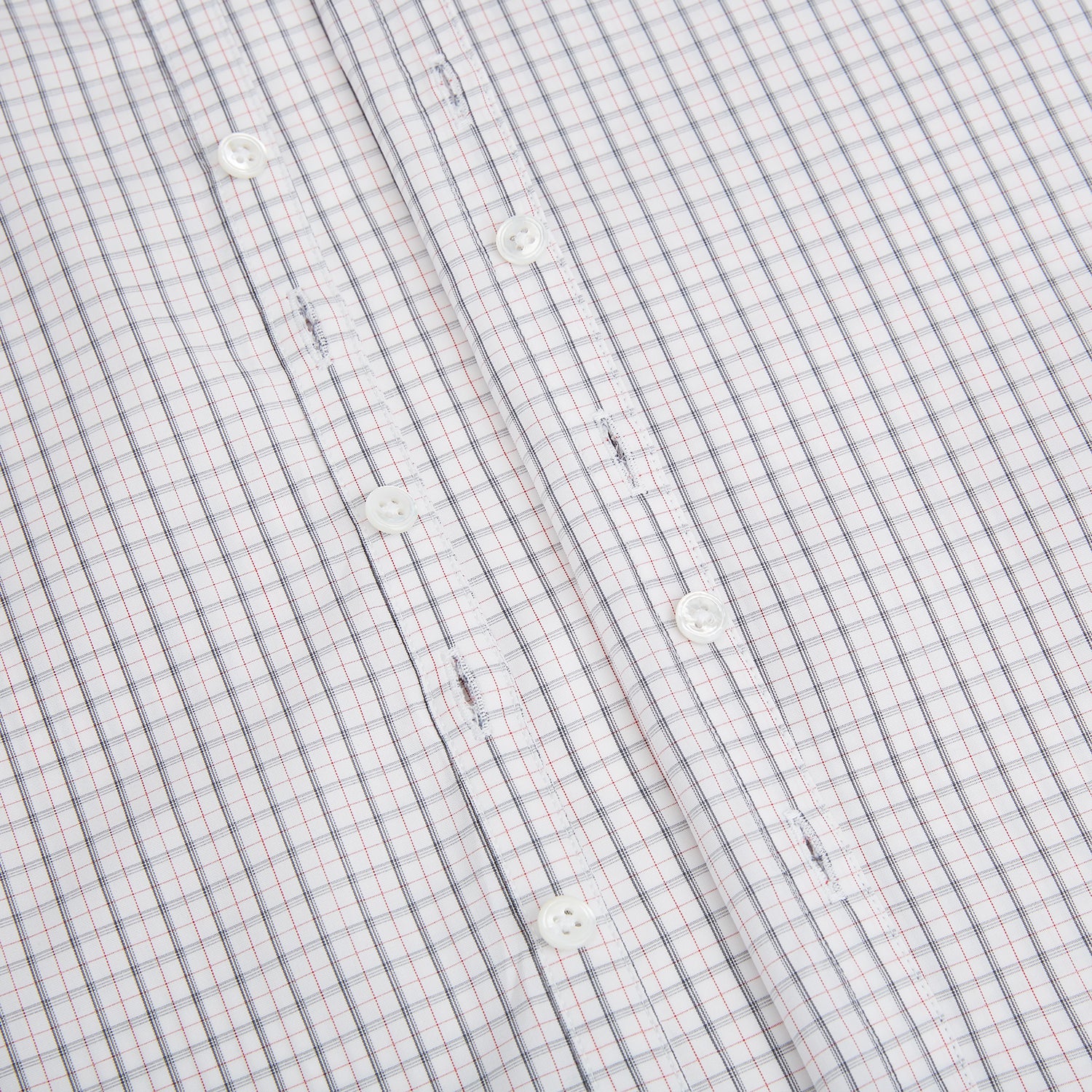 View 8 of product The Blue and Red Graph Check Westminster Shirt by Turnbull & Asser features a classic collar, long sleeves, and British craftsmanship, with a blue and red checkered pattern on white, displayed flat on a white surface.