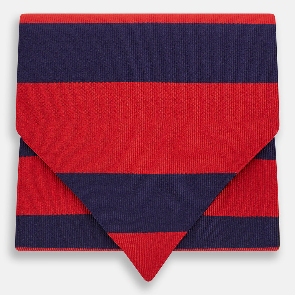 The Turnbull & Asser Wide Red Stripe and Navy Silk Cravat features bold diagonal stripes, adding a refined touch of British elegance to any ensemble.