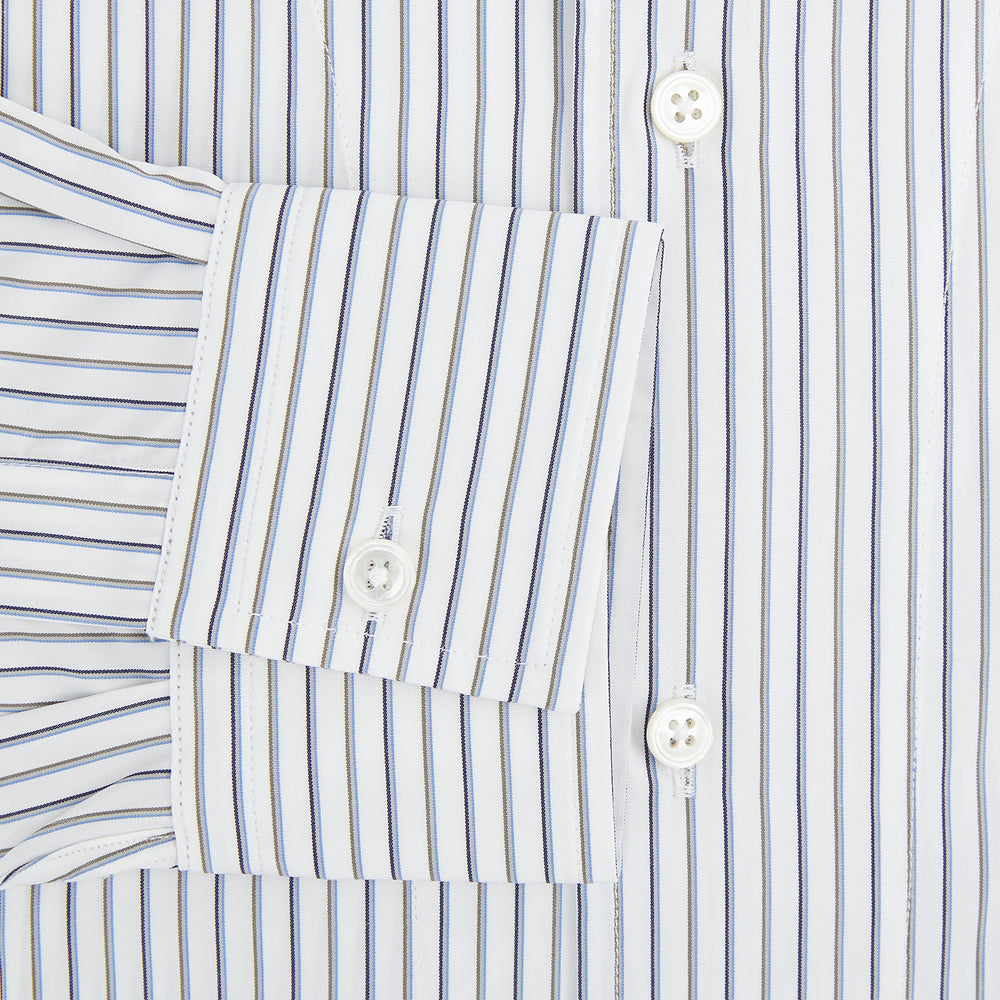 The Brown Multi Stripe Quarzo Nightshirt by Turnbull & Asser is a long-sleeve, knee-length Italian cotton nightshirt with brown and blue stripes, a collar, button placket, chest pocket, and cuffs. The dress is laid flat on a white background.