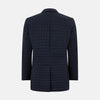 View 3 of product The Fulham Navy Single-Breasted Quilted Blazer by Turnbull & Asser features a notched lapel, three black buttons, a chest pocket, and two front flap pockets. Shown on a plain white background—ideal for the modern gentleman.