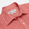 View 3 of product The Turnbull & Asser Weekend Fit Red Check Linen Shirt features a Derby collar, long sleeves with 1-button cuffs, and a single chest pocket—ideal for summer style. Shown against a plain white background.