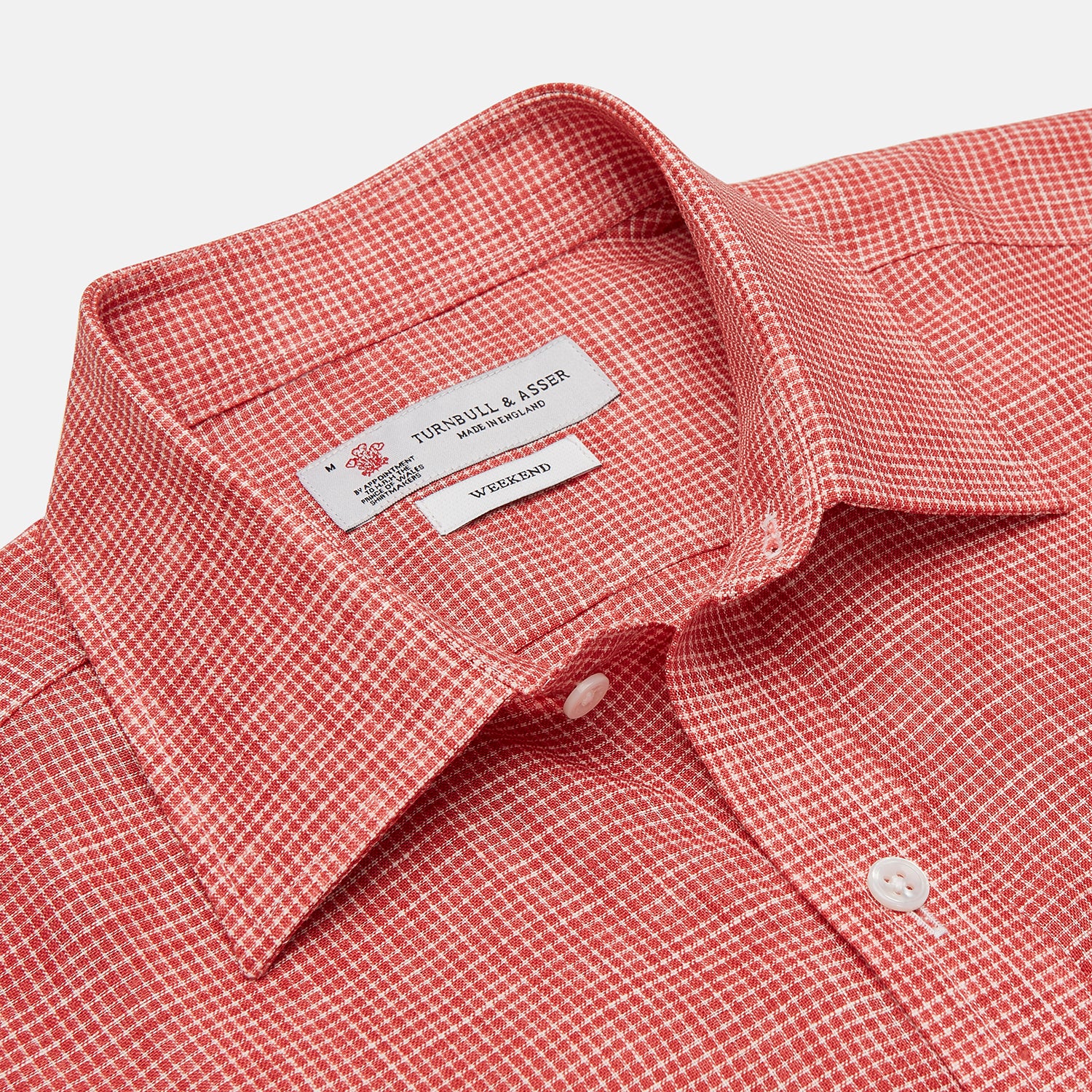 View 3 of product The Turnbull & Asser Weekend Fit Red Check Linen Shirt features a Derby collar, long sleeves with 1-button cuffs, and a single chest pocket—ideal for summer style. Shown against a plain white background.
