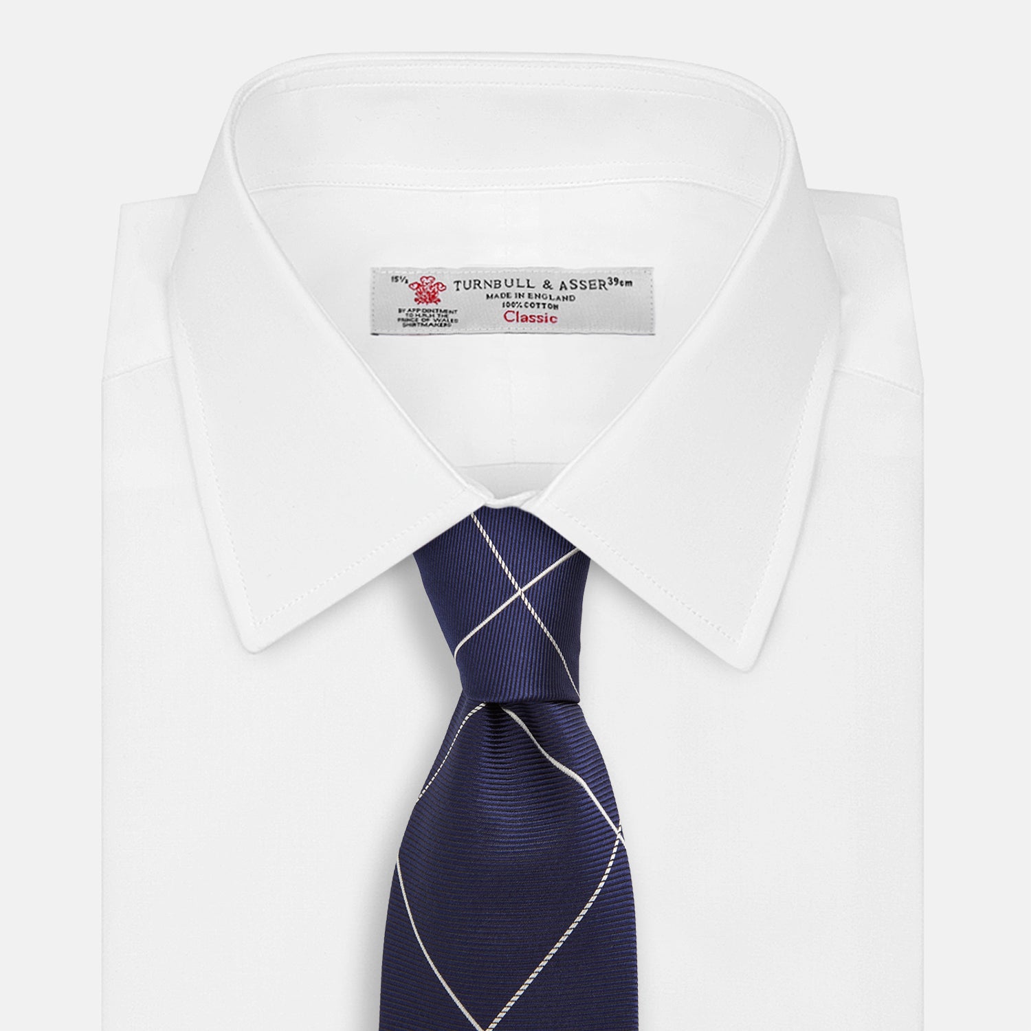 View 2 of product The Turnbull & Asser WINDOW PANE NAVY WHITE TIE features navy blue silk with a subtle diagonal ribbed texture and white windowpane checks, making it the perfect men’s accessory for any formal occasion.