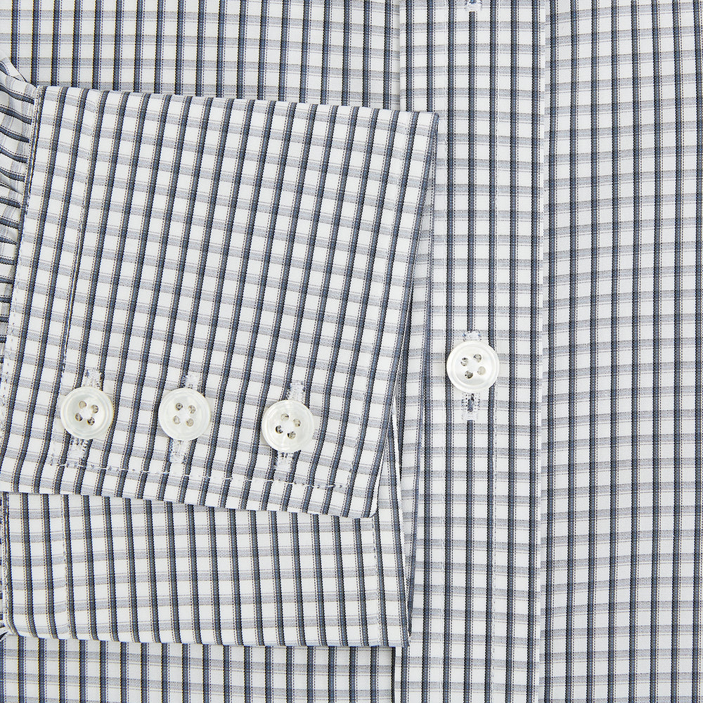 The Grey Double Graph Mayfair Shirt by Turnbull & Asser is a long-sleeve, button-down cotton shirt with a black and white double graph check, chest pocket, and classic collar.