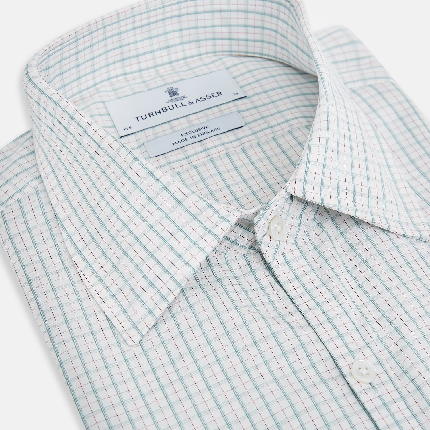 View 2 of product The Turnbull & Asser Turquoise and Red Multi Check Westminster shirt features long sleeves, a standard collar, and buttoned cuffs, showcasing fine British craftsmanship. It’s pictured laid flat on a white background.