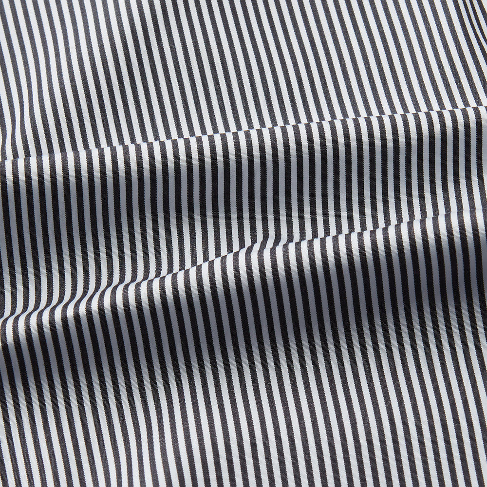 The Turnbull & Asser Black Candy Stripe Cotton Regular Fit Mayfair Shirt features long sleeves, a T&A collar, white buttons, and thin black stripes, displayed on a plain white background.
