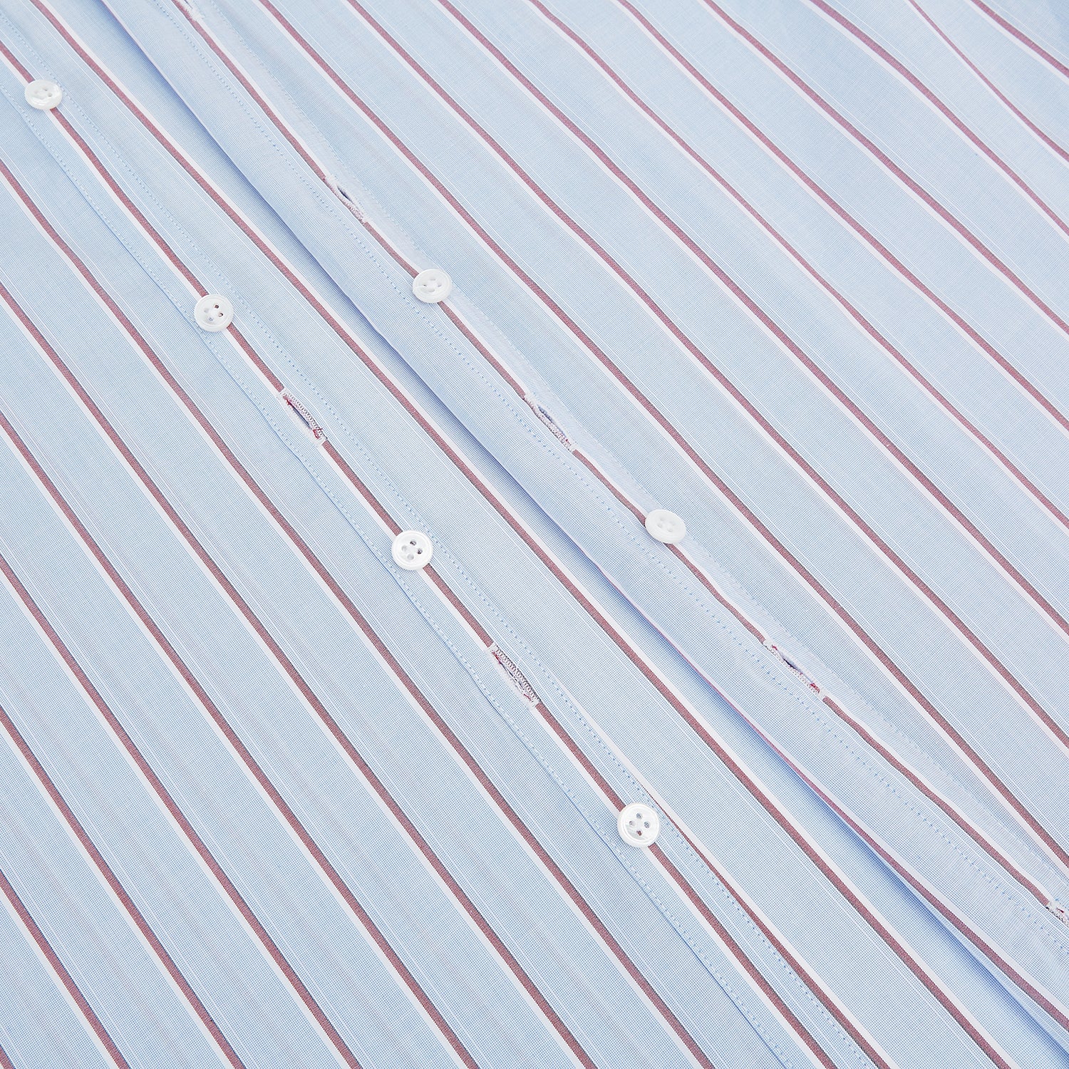 View 7 of product The Turnbull & Asser Blue and Burgundy Multi-Stripe Westminster Shirt features a pointed collar and long sleeves, laid flat on a white background to highlight its fine British craftsmanship.