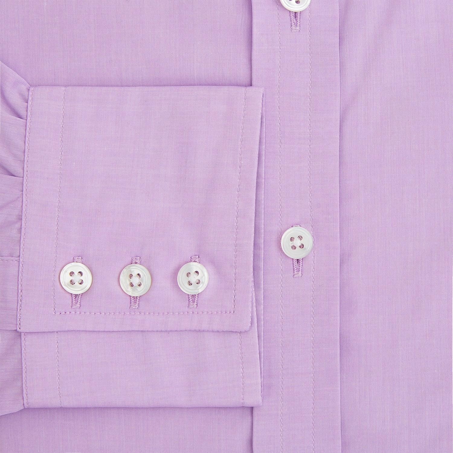 View 4 of product The Turnbull & Asser Purple Pink Mayfair Shirt is a men's formal, long-sleeve button-up with a classic collar and buttoned cuffs, shown in light purple against a plain white background.