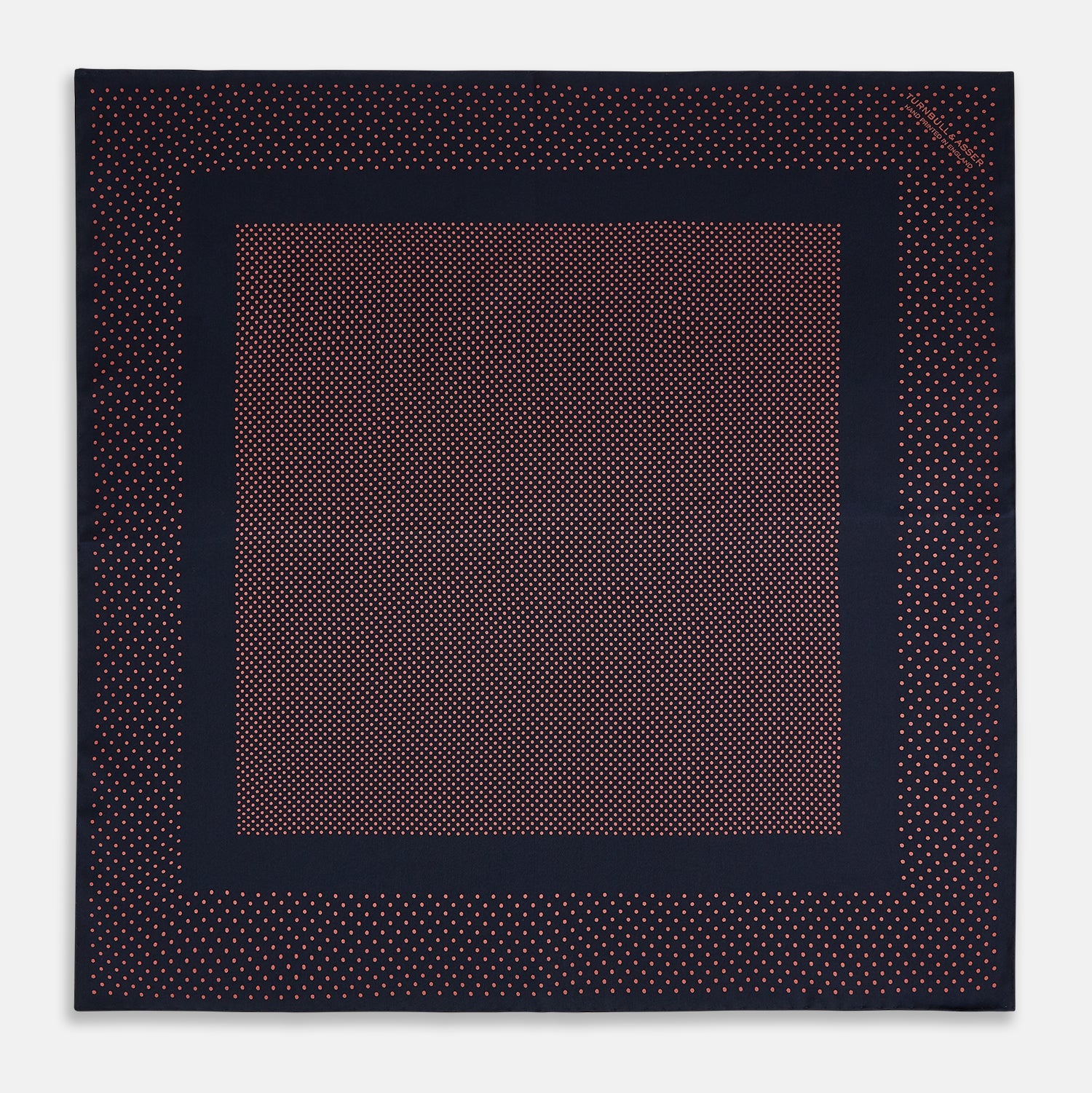 View 4 of product The Turnbull & Asser Navy and Orange Dot Silk Pocket Square features exquisite handmade craftsmanship.