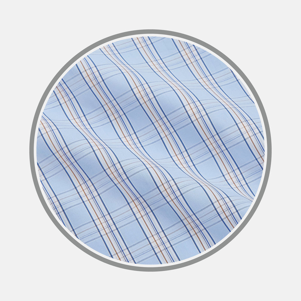 Close-up of Turnbull & Asser's Pale Blue Multi-check Cotton Fabric, featuring thin orange and dark blue lines, shown in a circular frame on a white background.