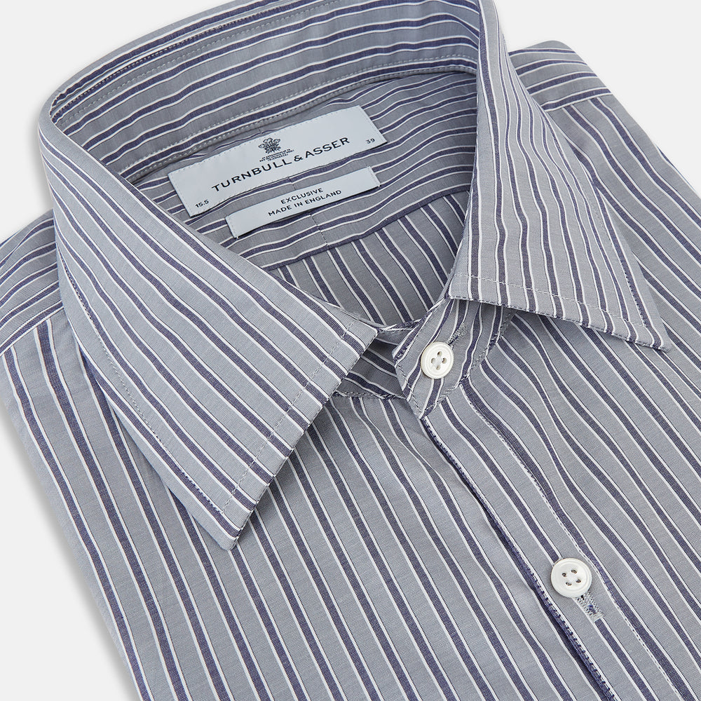 The Turnbull & Asser Grey Ticking Stripe Westminster Shirt features thin vertical grey stripes and a classic collar, showcased against a plain white background.