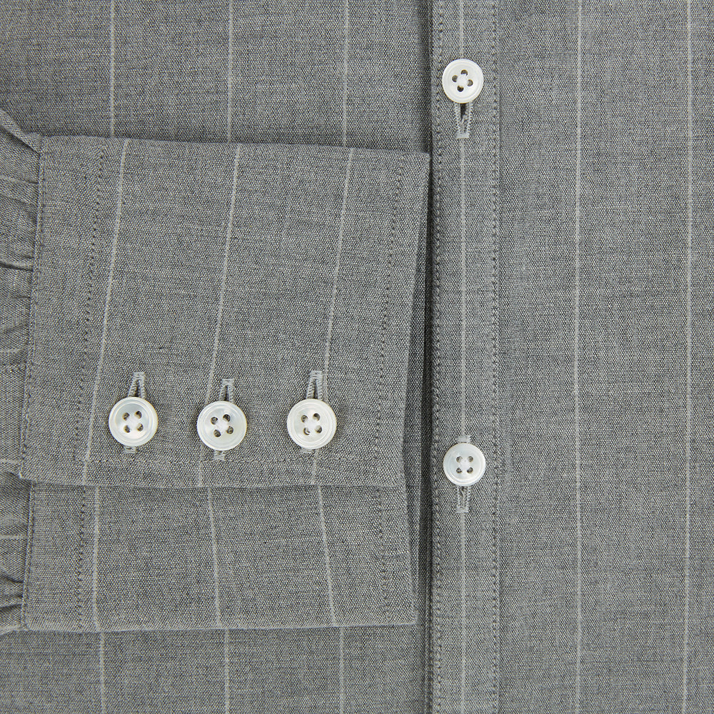 The Grey Wide Stripe Westminster Shirt by Turnbull & Asser features long sleeves, buttoned cuffs, a Turnbull collar, and classic British craftsmanship, shown on a white background.