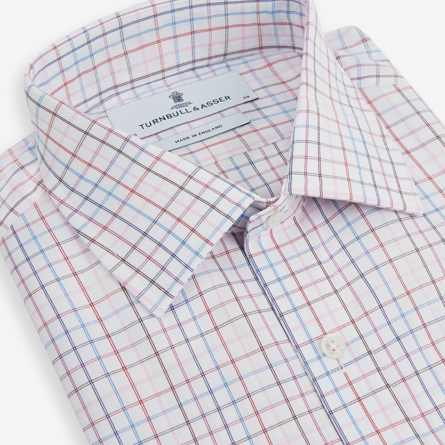 View 2 of product The Turnbull & Asser Pink Multi Double Grid Check Mayfair Shirt, made from organic cotton with a pointed collar and buttoned cuffs, features a light pink base with blue and red grid checks and is shown flat on a white background.