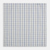 View 1 of product The Turnbull & Asser Blue and Navy Multi Check Hand-Rolled Handkerchief features a blue and white plaid design with thin, evenly spaced lines, shown flat against a white background.
