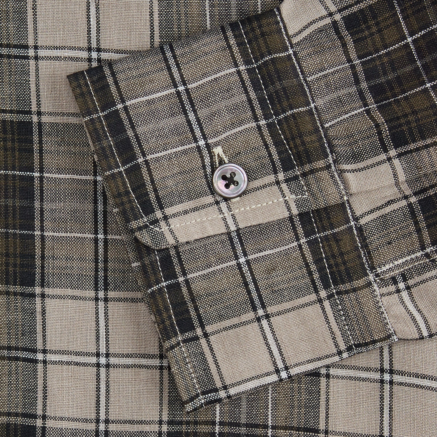View 3 of product The Brown Multi Check Linen Weekend Fit Unwin Shirt by Turnbull & Asser features a beige, brown, and black plaid pattern, stand collar, button-up front, long sleeves, and two buttoned chest pockets.