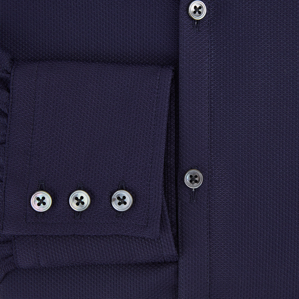 The Navy Textured Windsor Shirt by Turnbull & Asser features long sleeves, a Windsor collar, buttoned cuffs, and white buttons—a fine example of British craftsmanship—set against a plain white background.
