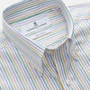 View 3 of product A man wears the Turnbull & Asser Yellow Multi Blazer Stripe Weekend Fit Suffolk Shirt, standing against a beige background with his hands relaxed—a casual look perfect for weekends.