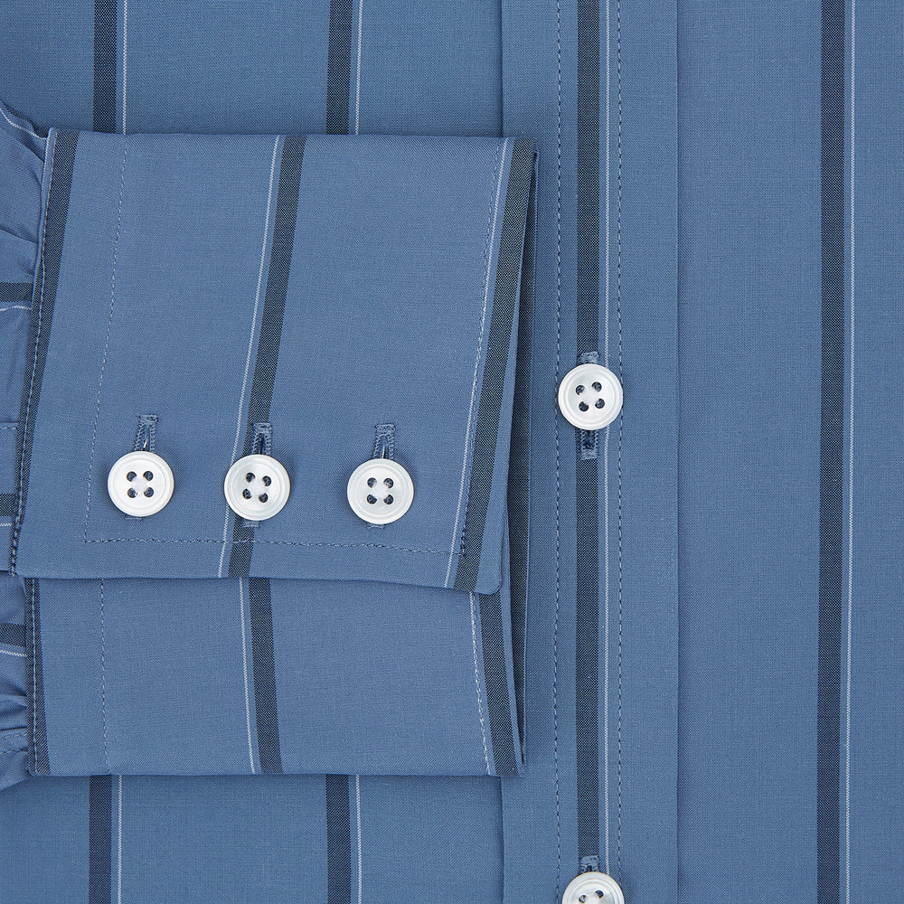 The Turnbull & Asser Steel Grey and Navy Track Stripe Mayfair Shirt features long sleeves, a collar, white buttons, and a relaxed fit, shown on a plain white background.