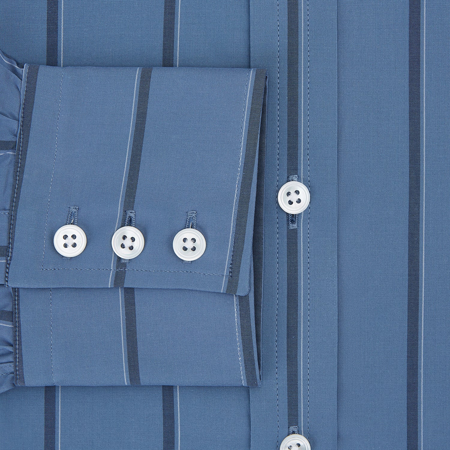 View 4 of product The Turnbull & Asser Steel Grey and Navy Track Stripe Mayfair Shirt features long sleeves, a collar, white buttons, and a relaxed fit, shown on a plain white background.