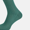 View 4 of product The Sage Long Sock by Turnbull & Asser is a knee-high, ribbed green sock made from premium Egyptian cotton, displayed against a plain white background.