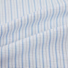 View 6 of product The Turnbull & Asser Blue Graph Check Mayfair Shirt features a classic T&A collar, Mayfair fit, buttoned cuffs, and long sleeves with light blue graph checks on a white background.