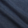 View 4 of product The Turnbull & Asser Navy Check Weekend Fit Flannel Shirt features a stand collar, button front, two chest pockets with flaps, and 1-button cuffs, crafted from soft Italian cotton and shown laid flat on a white background.