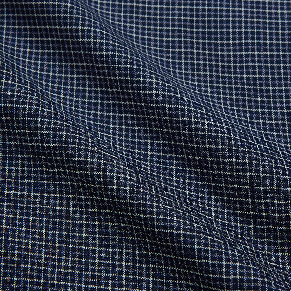 The Turnbull & Asser Navy Check Weekend Fit Flannel Shirt features a stand collar, button front, two chest pockets with flaps, and 1-button cuffs, crafted from soft Italian cotton and shown laid flat on a white background.
