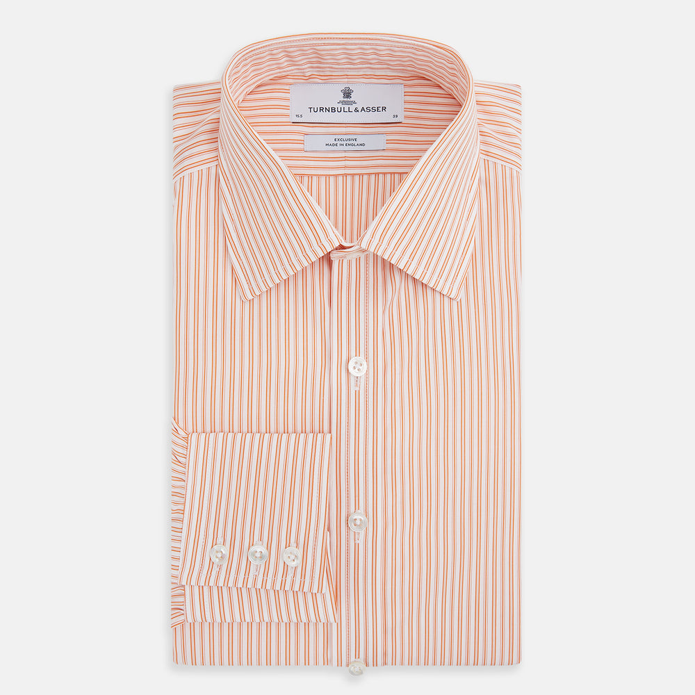 The Turnbull & Asser Orange Ticking Stripe Mayfair Shirt features thin vertical stripes, a classic T&A collar, and buttoned cuffs, shown on a plain white background.