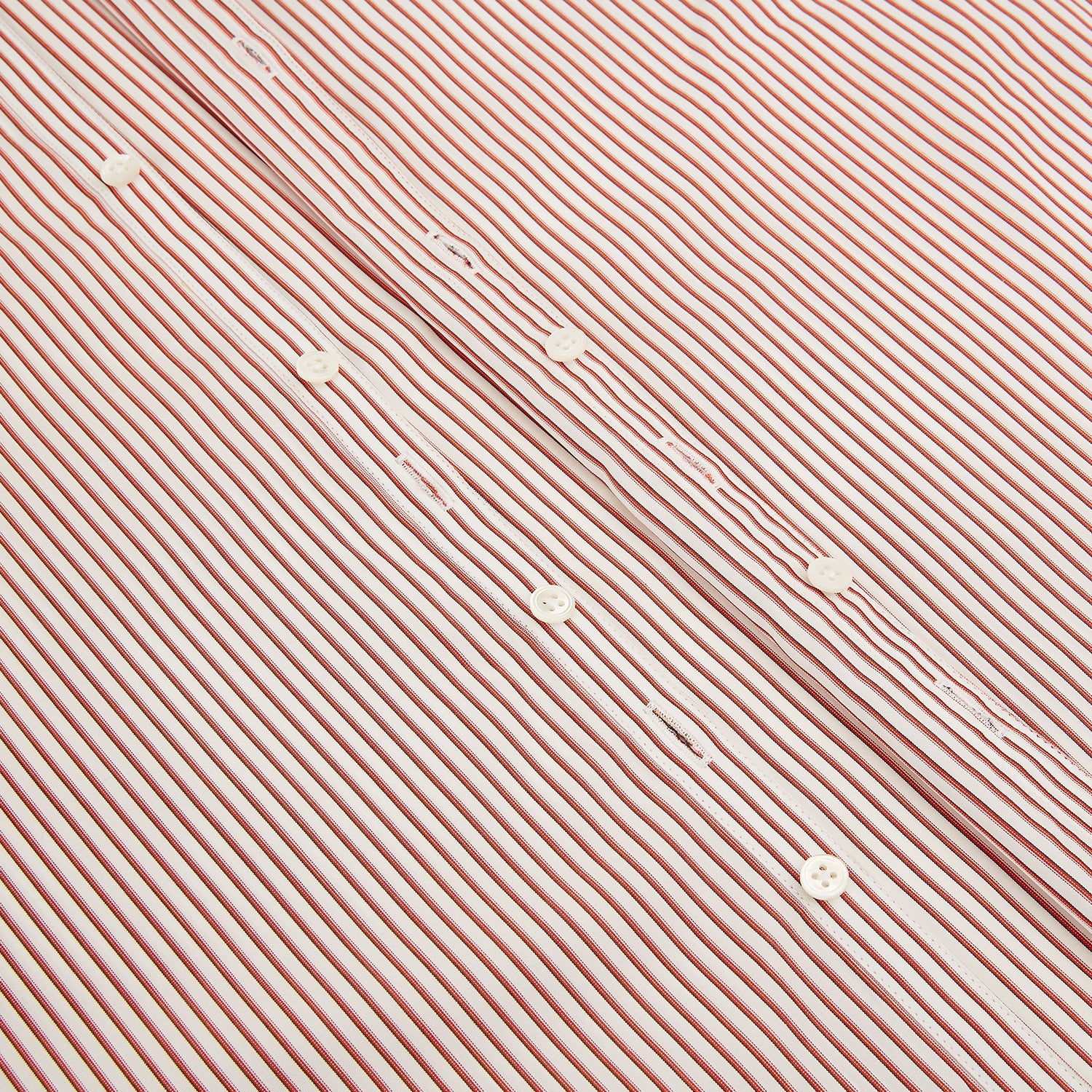 View 7 of product The Red Shadow Stripe Westminster Shirt by Turnbull & Asser features long sleeves, a Turnbull collar, thin red and white vertical stripes, white buttons, and showcases British craftsmanship against a plain white background.