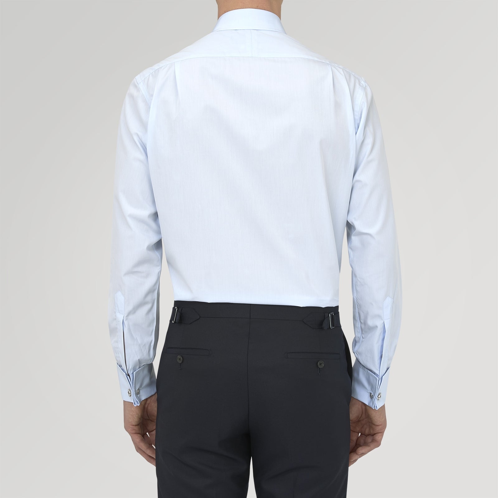 View 3 of product A neatly folded Turnbull & Asser Two-Fold 120 Light Blue Shirt, featuring a regent collar and double cuffs, is displayed against a plain white background.