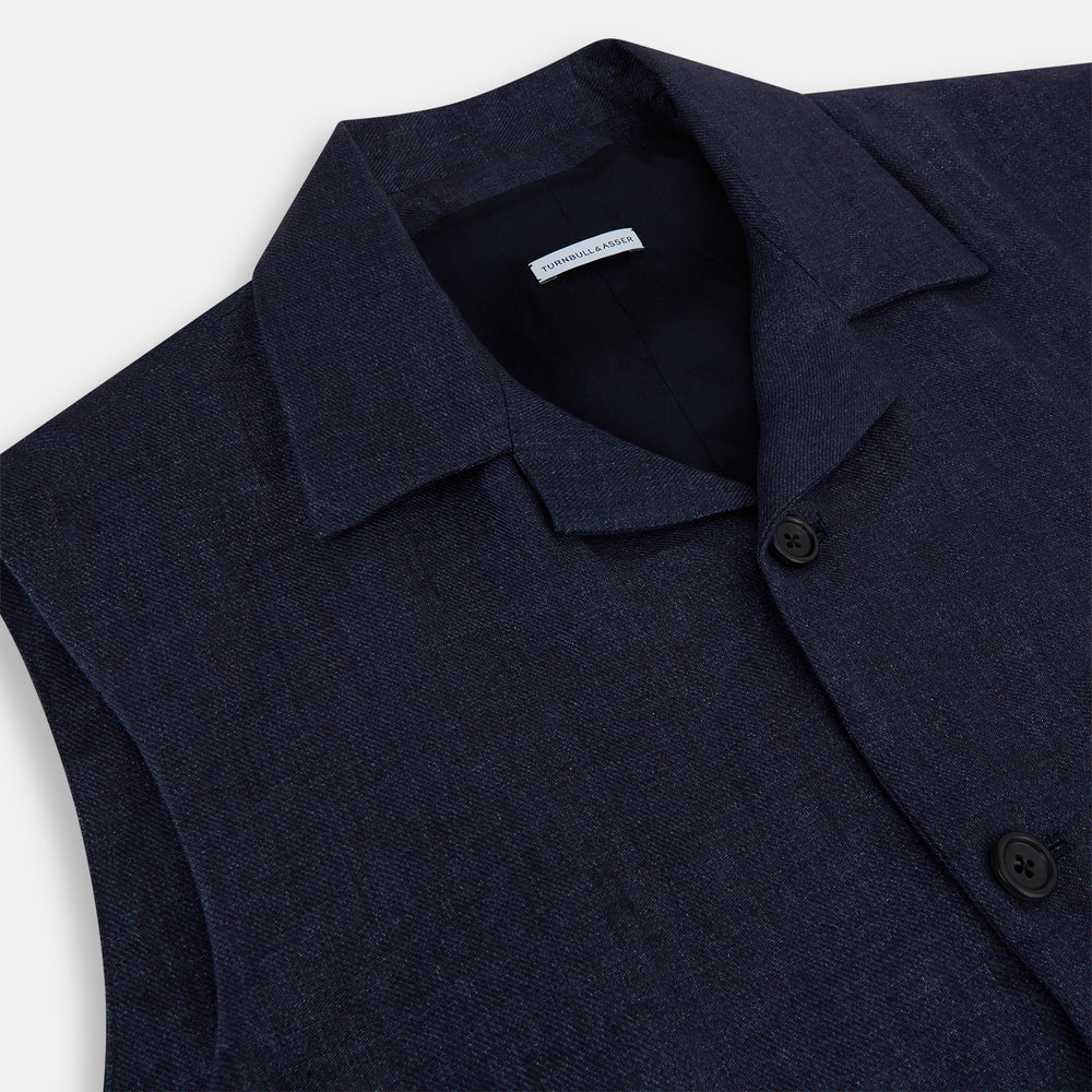 Turnbull & Asser Navy Collared Linen Waistcoat features a tailored fit, sleeveless design, button-up front, left chest pocket, and two zippered side pockets, shown against a plain white background.