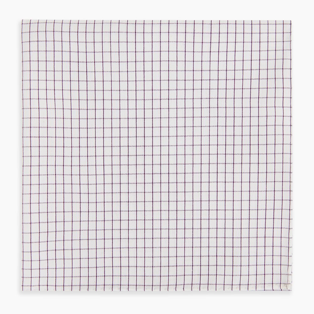 The Turnbull & Asser Hand Rolled Purple Graph Check Handkerchief features a white cloth with evenly spaced thin purple lines forming small squares, neatly laid flat against a white background.