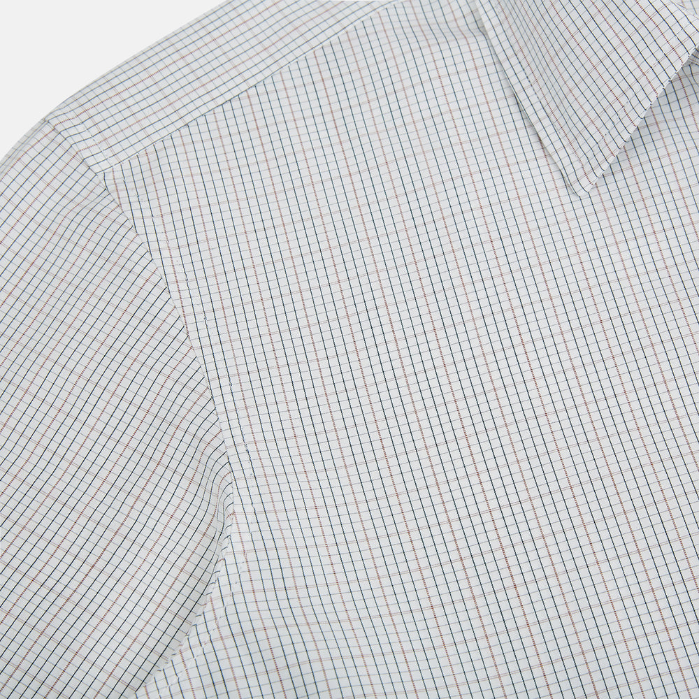 Turnbull & Asser's Forest Melange and Red Micro Check Windsor Shirt features a subtle check pattern, pointed collar, and white buttons—showcasing refined British craftsmanship.