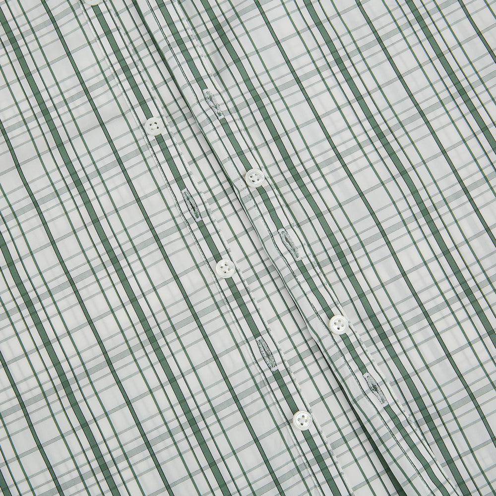 The Turnbull & Asser Sage Green Plaid Check Westminster Shirt features a collared, long-sleeve button-up design with a white base and sage green plaid pattern, showcasing classic British craftsmanship against a clean white background.