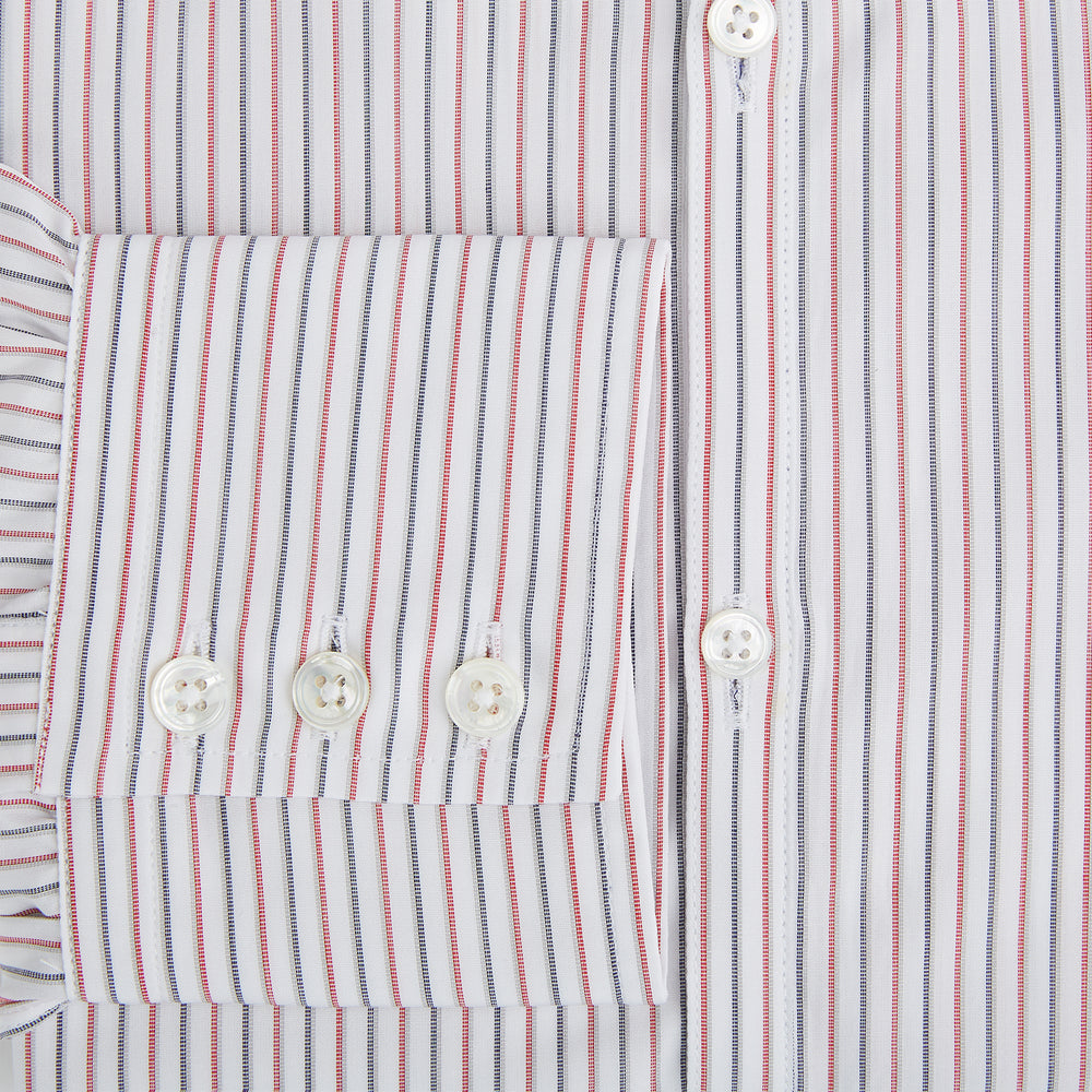 The Turnbull & Asser Red and Blue Double Stripe Westminster Shirt is a long-sleeved, button-up dress shirt with a formal collar, featuring narrow red and blue stripes on white, shown against a plain white background.