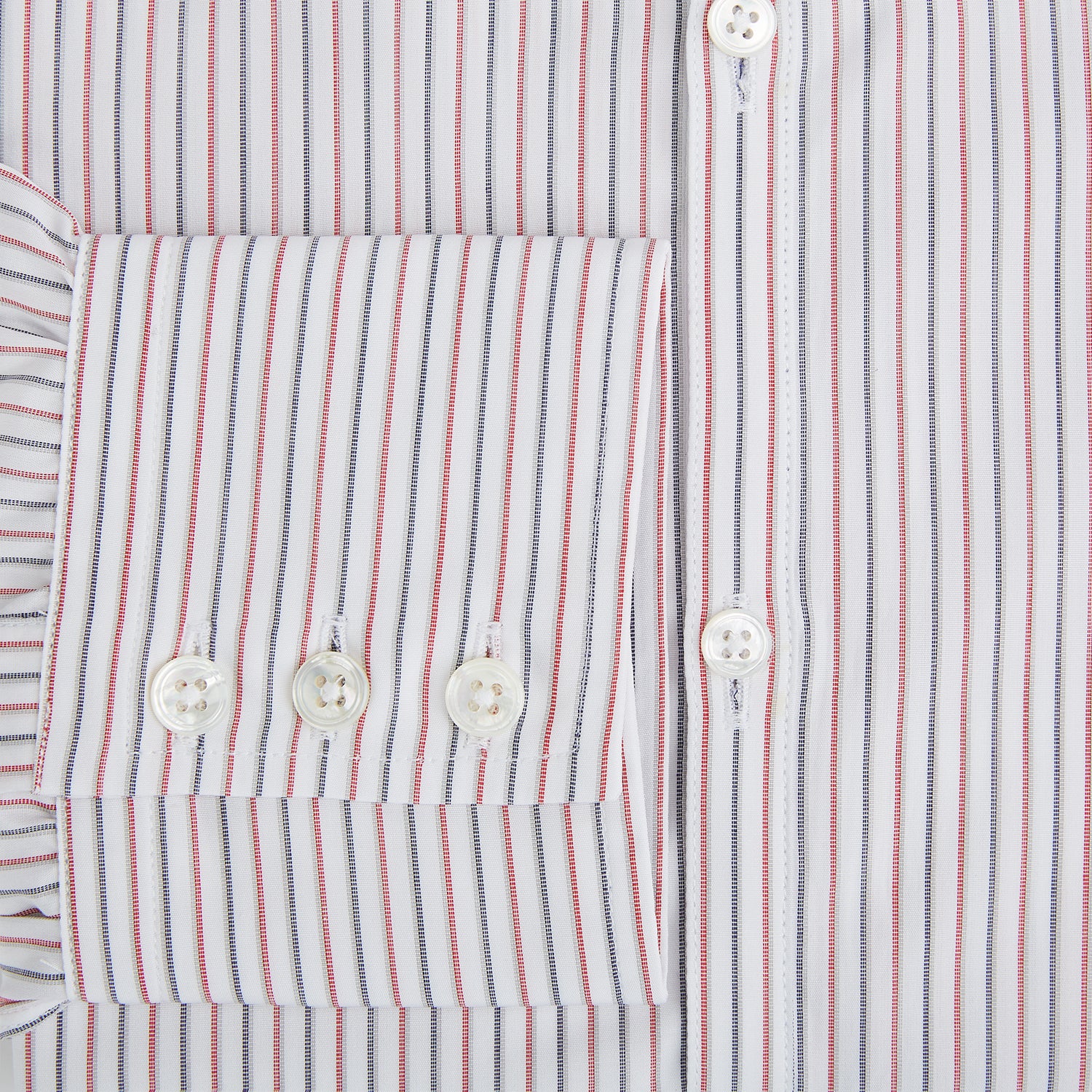 View 4 of product The Turnbull & Asser Red and Blue Double Stripe Westminster Shirt is a long-sleeved, button-up dress shirt with a formal collar, featuring narrow red and blue stripes on white, shown against a plain white background.