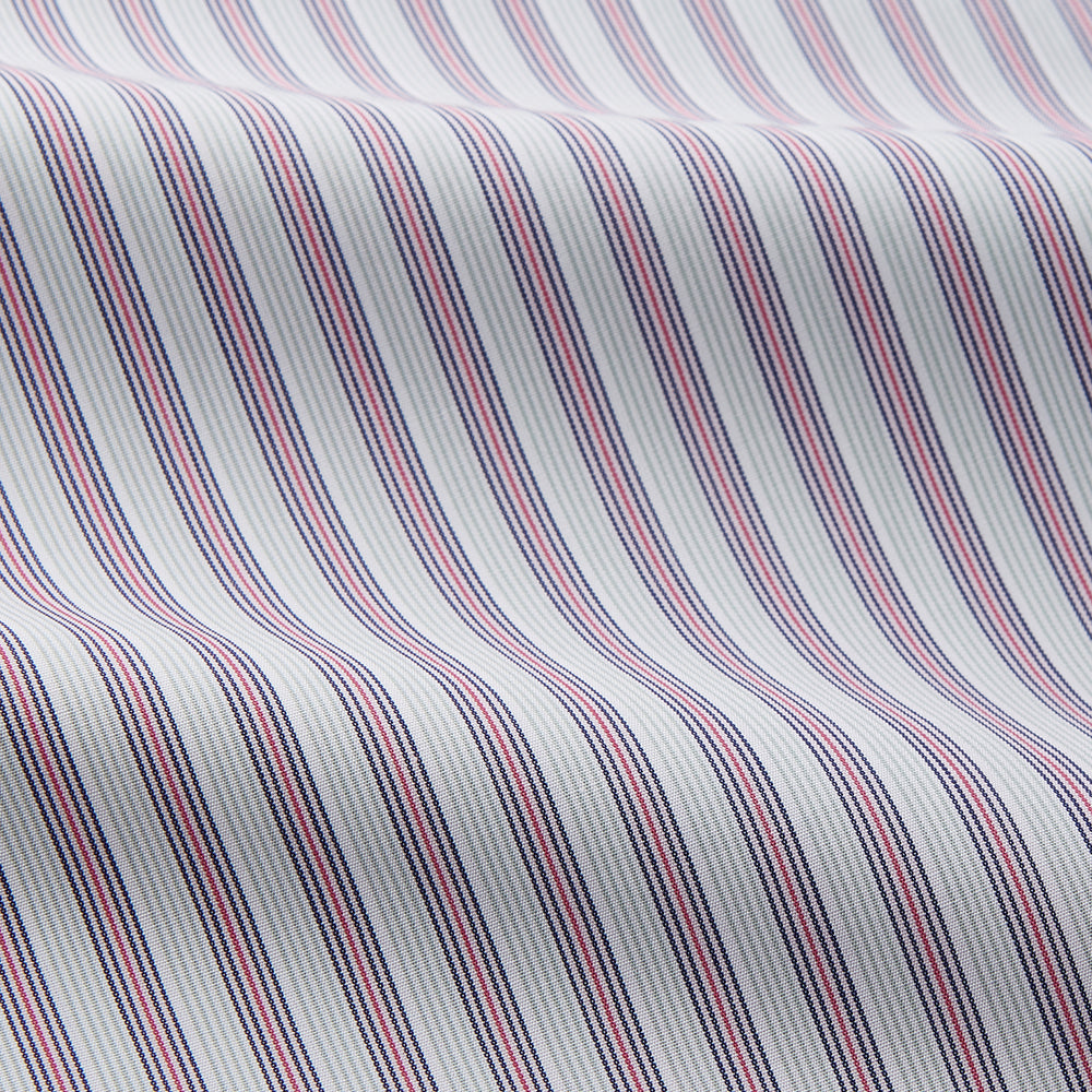 The Turnbull & Asser Red and Blue Multi Stripe Cotton Sussex Nightshirt features long sleeves, a knee-length cut, collared neckline, button placket, chest pocket with dark trim, and rounded hem for luxurious sleepwear.