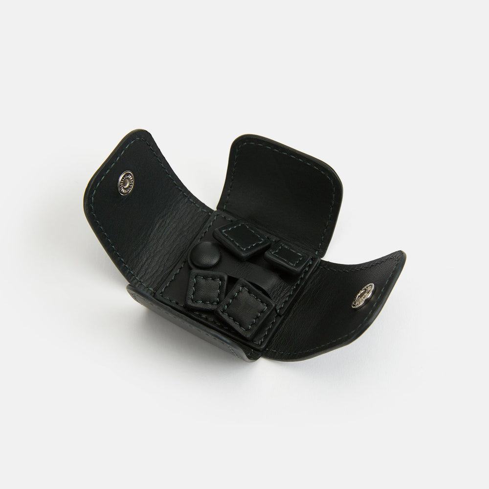 Turnbull & Asser Forest Green Leather Cufflinks feature square ends, visible stitching, and braided leather connectors, displayed on a white background—a refined choice in men's accessories.