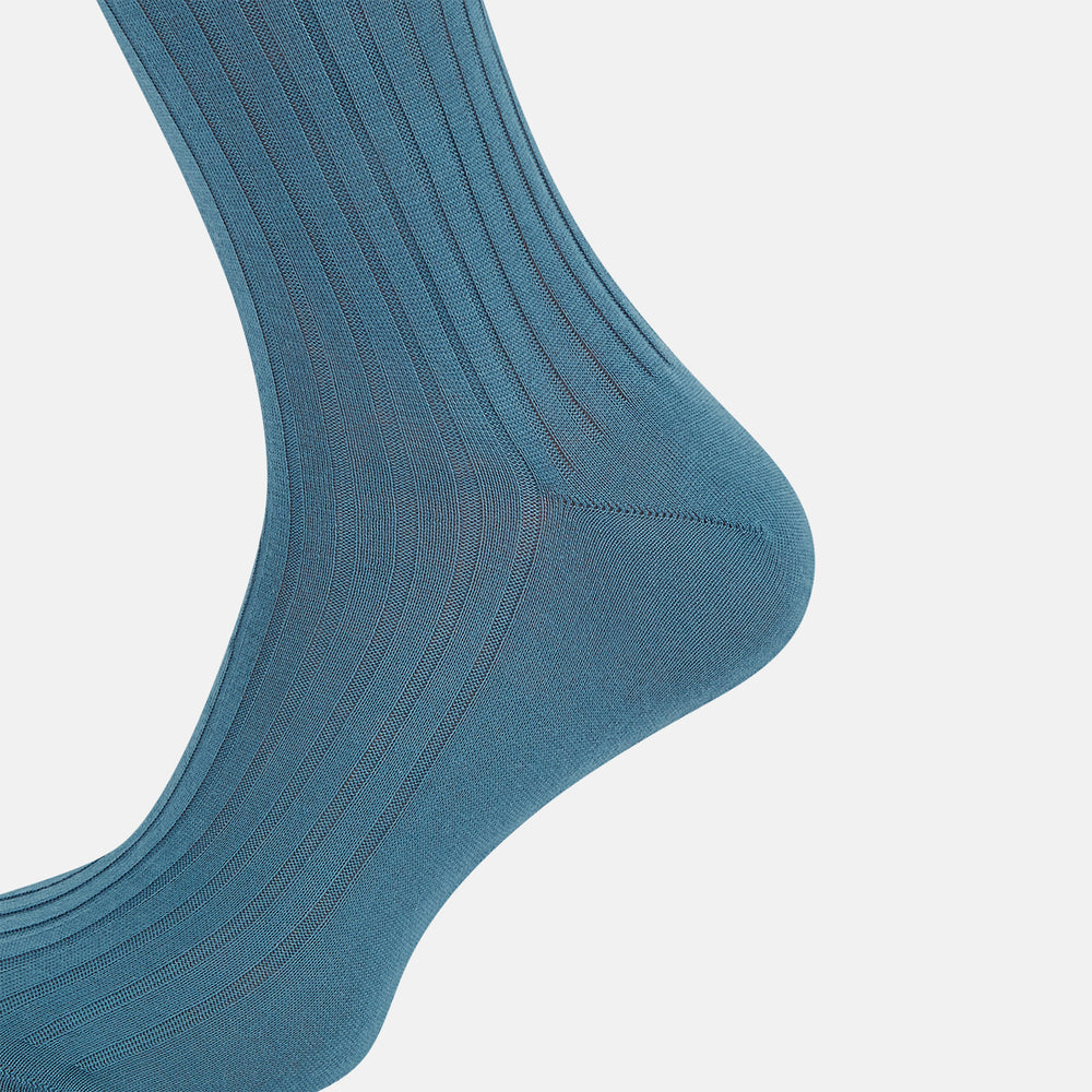 The Azzurro Organic Cotton Mid-Length Sock by Turnbull & Asser, featuring a ribbed texture in blue, is displayed against a plain white background.